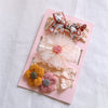 White bow/yellow pink flowers
