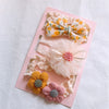 Yellow bow/yellow pink flowers
