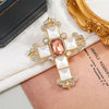 White palace style cross peach white palace style cross peach