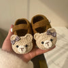 A pair of brown baby bear shoes with tools and bows in random colors - not a finished product, you need to weave it yourself