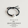 Silver bear black rope