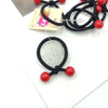 A little red bead hair tie