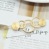 Five circle button-shaped gold 27 / individually bagged frog clips