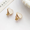 A pair of love ear clips