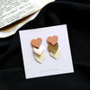 A pair of s925 silver heart stud earrings