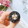 Rough flash bracket - no. 22 - three pearl flowers - black