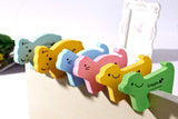 SYGA Children Safety No Finger Pinch Foam Door Stopper Colorful Animal Cushion Protection from Door Slamming Baby Child Kid Cushiony Finger Hand Safety, Curve Doggie Shaped Door Stop Guard-12Pcs Set, Multicolor