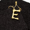 E.