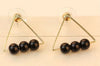 Three black beads