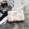 Pink and white cow: 9 card slots + 2 change slots