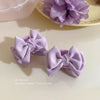 Small purple bow grab clip