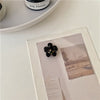 Black flower clip