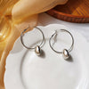 A pair of s925 silver needle silver stud earrings