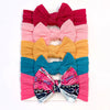 Wine red + pink + earthy yellow + navy blue + rose red