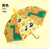 Yellow dinosaur tuba / black plastic umbrella
