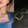 Silver exaggerated stud earrings