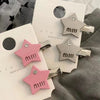 A pink letter small diamond star duckbill clip