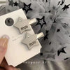 A silver letter small diamond star duckbill clip