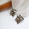A pair of s925 silver needle silver stud earrings