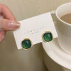 A pair of s925 silver pin green stud earrings