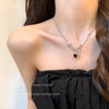 Black heart pin necklace