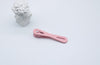 Pale pinkish gray