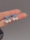 Hollow bow rice earrings