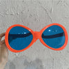 Huge oval orange glasses