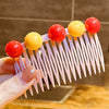Button hair comb