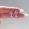 Diamond cross stud earrings