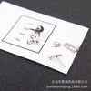Pair of claw earrings + bullet earplugs