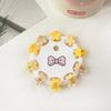 10 card packs - small flower yellow / plastic/resin