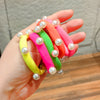 Fluorescent white pearl