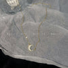 Gold moon necklace