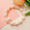 Light pink star + yellow bead
