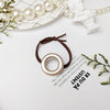Round metallic hair tie