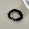 Through yarn small square beads - black