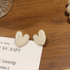 A pair of s925 silver heart stud earrings