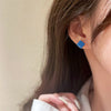 Blue braided stud earrings