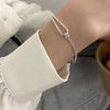 Knotted half bangle bracelet