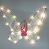 Pink wings + warm light / one size fits all
