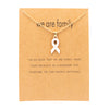 Gold card with white ribbon