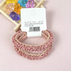 A pair of light pink lace hair ties