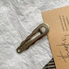 Wavy metal clip