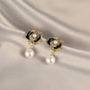 Black camellia stud earrings