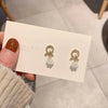 A pair of silver stud earrings