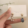 A pair of asymmetric earrings