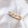 One beige hairpin