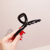 Black glossy cross