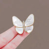 Golden butterfly emerges from cocoon